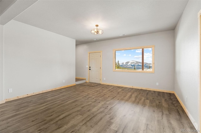 empty room with wood-type flooring