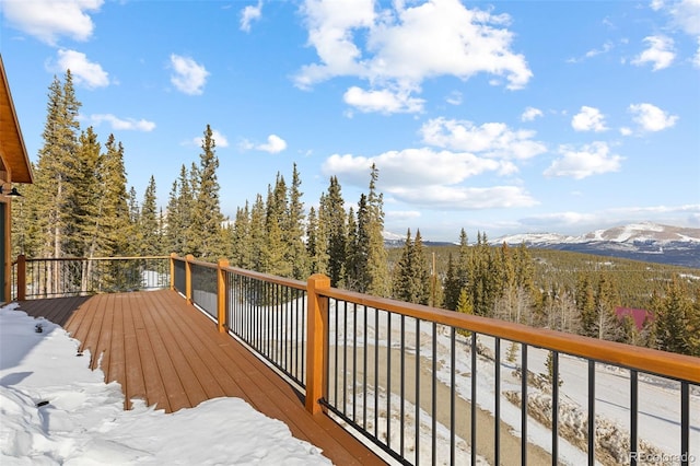 wooden deck featuring a mountain view