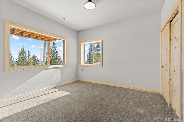 unfurnished bedroom featuring a closet and carpet