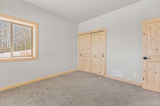 unfurnished bedroom featuring carpet