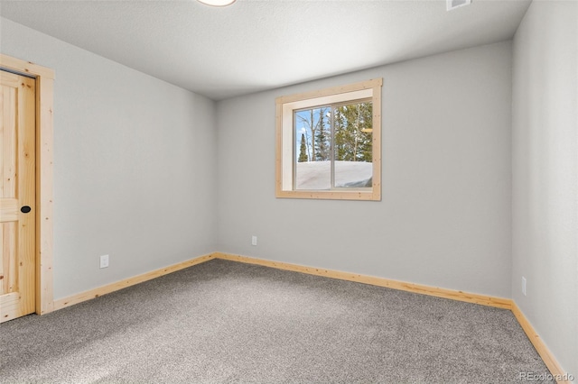 unfurnished room featuring carpet flooring