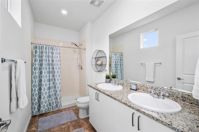 1106 Oak Cir, Lakewood, CO 80215 - full bathroom with a tile shower and double vanity
