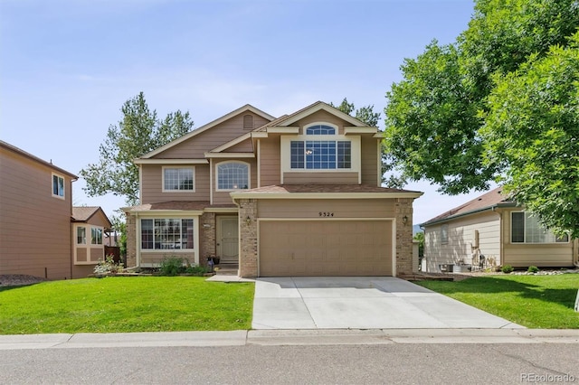 view of front facade with a garage and a front lawn