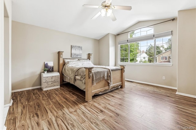 bedroom featuring lofted ceiling, hardwood / wood-style floors, and ceiling fan