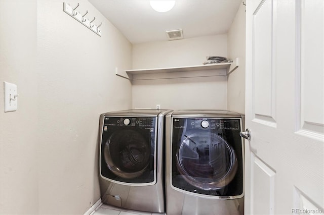 laundry area featuring separate washer and dryer