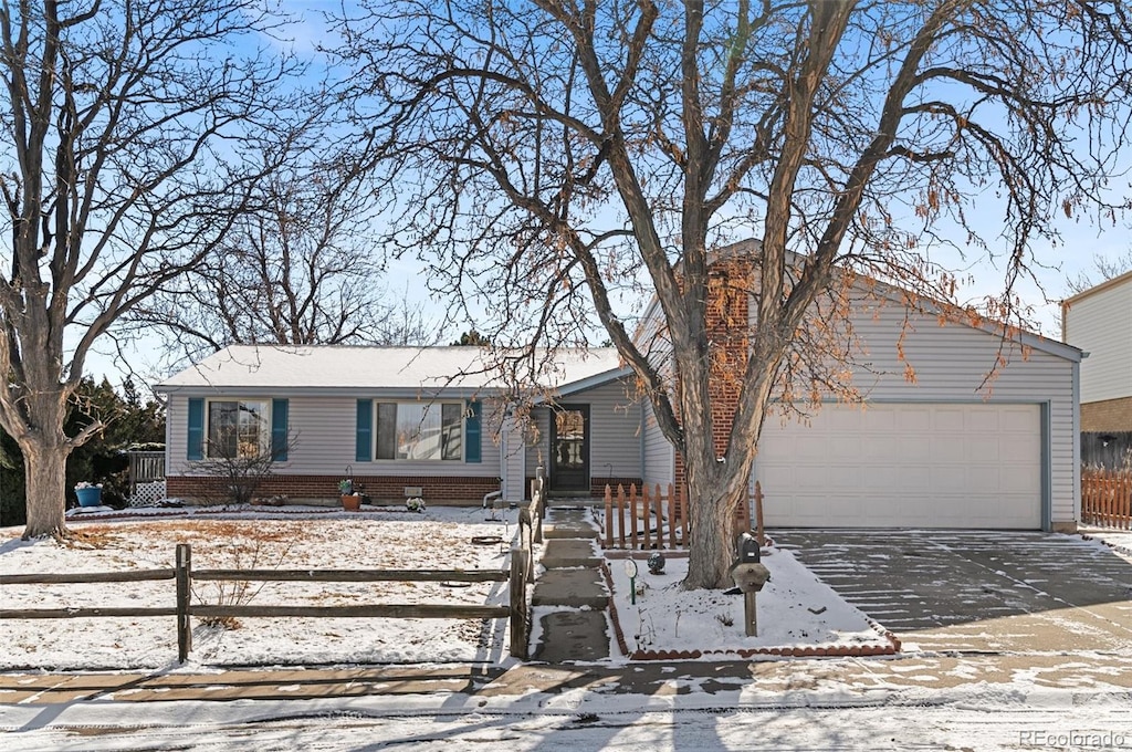 ranch-style home featuring a garage