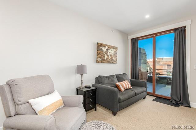 828 Grand Ave Unit 201C, Grand Lake, CO 80447 - living room featuring light carpet, recessed lighting, and baseboards