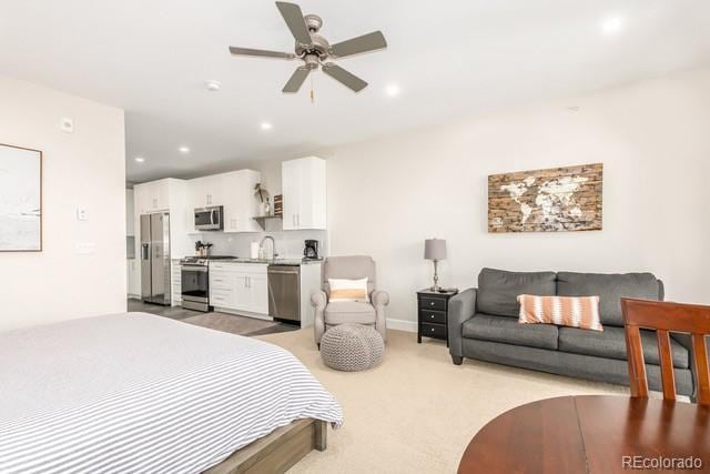 828 Grand Ave Unit 201C, Grand Lake, CO 80447 - bedroom with stainless steel fridge with ice dispenser, recessed lighting, light colored carpet, and ceiling fan