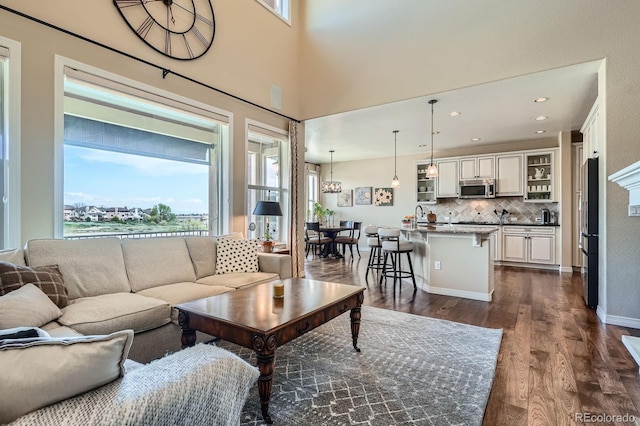 3181 Firenze Pl, Highlands Ranch, CO 80126 - living room featuring dark wood-style floors and recessed lighting
