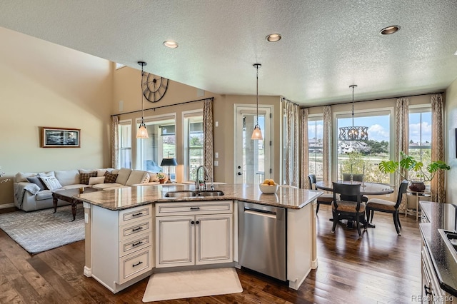 3181 Firenze Pl, Highlands Ranch, CO 80126 - kitchen featuring a sink, stainless steel dishwasher, a textured ceiling, open floor plan, and dark wood-style flooring