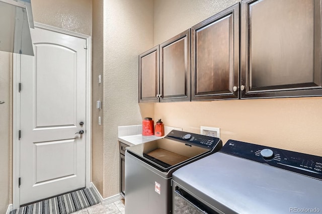 3181 Firenze Pl, Highlands Ranch, CO 80126 - laundry room with a textured wall, independent washer and dryer, cabinet space, and baseboards