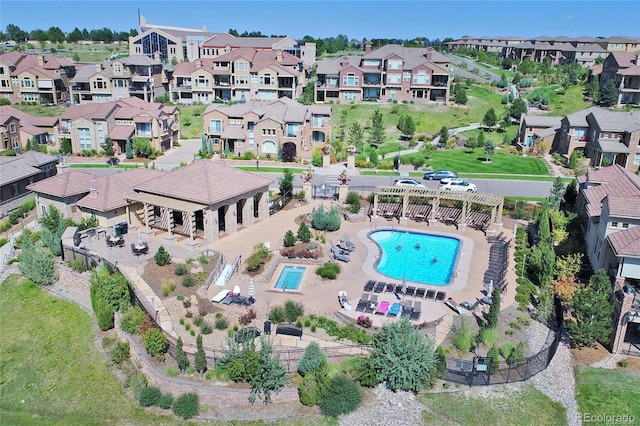 3181 Firenze Pl, Highlands Ranch, CO 80126 - aerial overview of property's location with a pool area and nearby suburban area