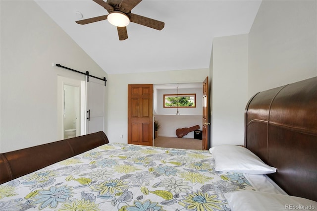 bedroom featuring high vaulted ceiling, connected bathroom, ceiling fan, and a barn door