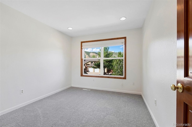 spare room featuring carpet