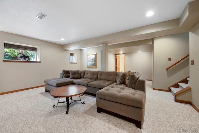 living room featuring light carpet