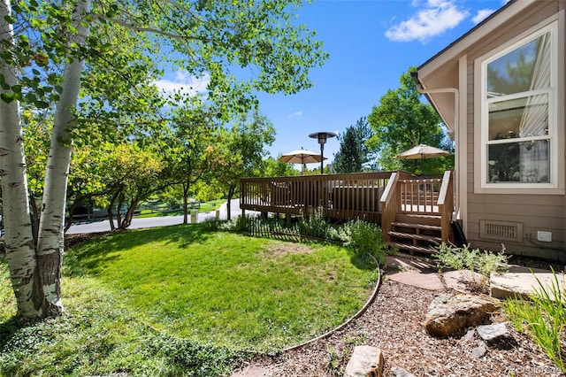 view of yard featuring a deck