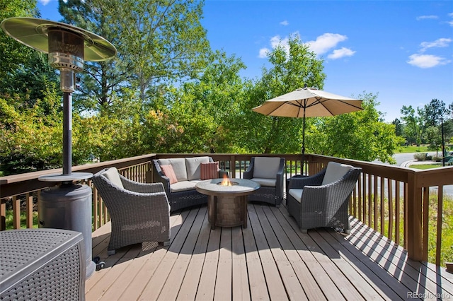 deck featuring an outdoor fire pit