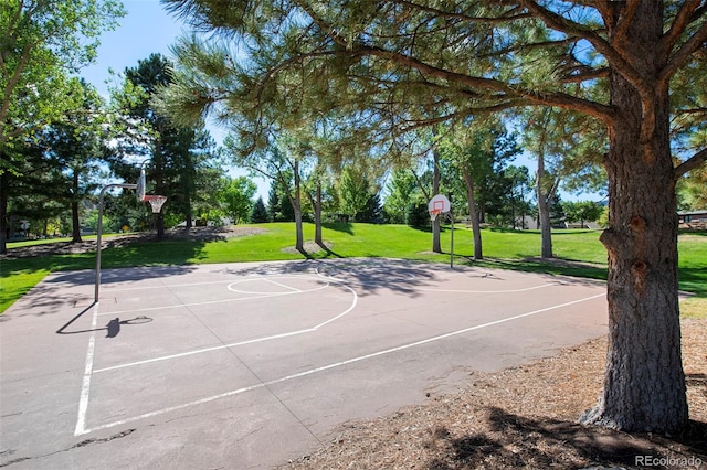 view of basketball court featuring a lawn