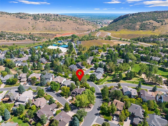 birds eye view of property with a mountain view