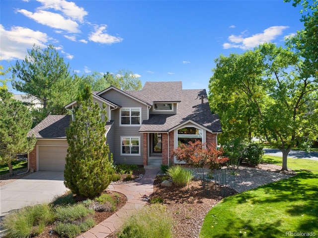 front of property featuring a front yard and a garage