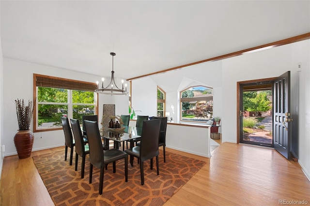 dining room featuring an inviting chandelier and hardwood / wood-style floors