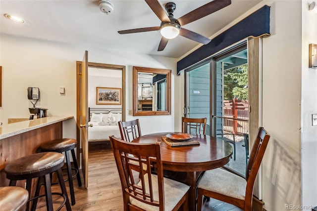 dining area featuring light hardwood / wood-style floors and ceiling fan