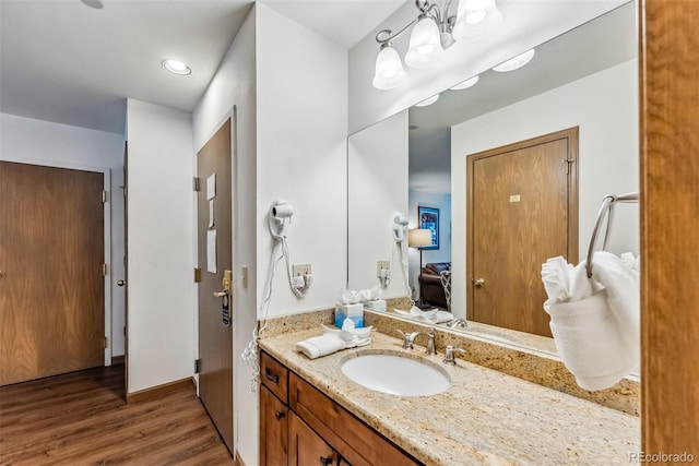 bathroom with vanity and hardwood / wood-style flooring