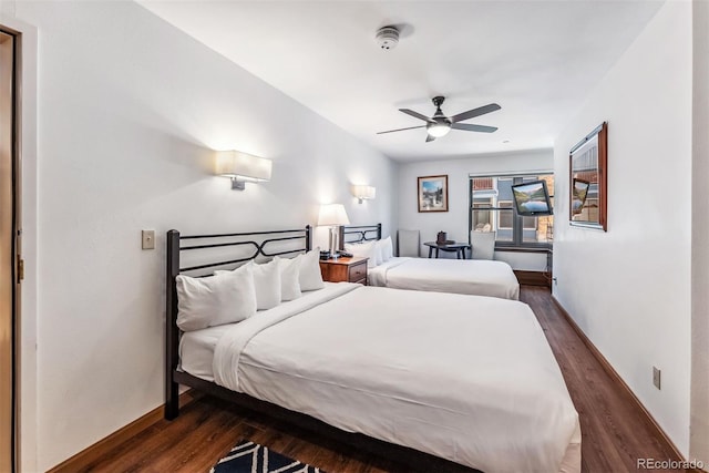 bedroom featuring ceiling fan and dark hardwood / wood-style flooring