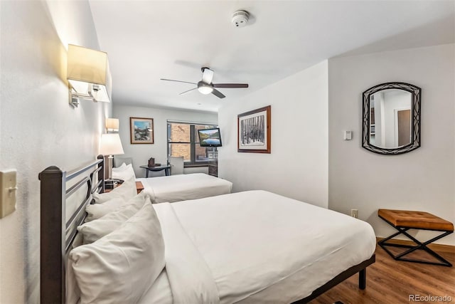 bedroom featuring ceiling fan and hardwood / wood-style floors