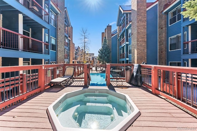 view of swimming pool featuring a wooden deck