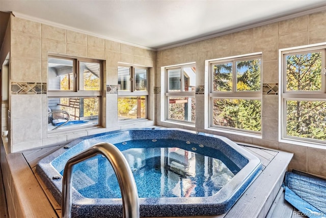 view of swimming pool featuring an indoor in ground hot tub