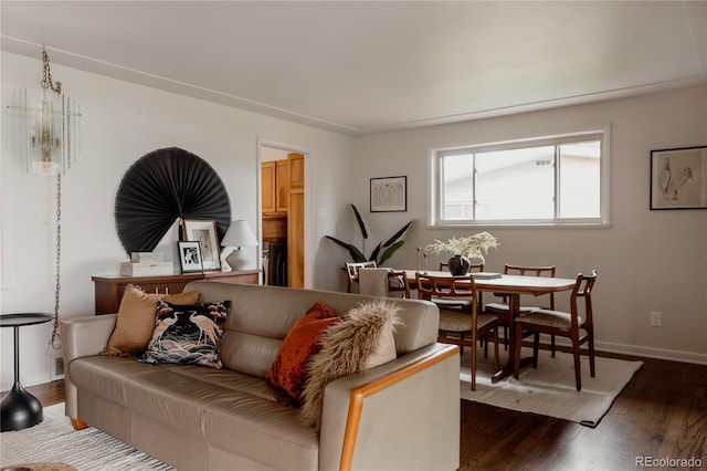 6530 W 26th Ave, Edgewater, CO 80214 - living room featuring dark wood-type flooring, washer / clothes dryer, and baseboards