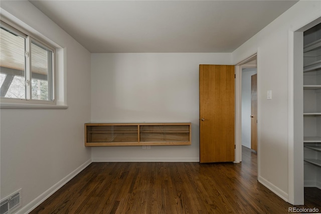 6530 W 26th Ave, Edgewater, CO 80214 - spare room featuring dark wood-type flooring and baseboards