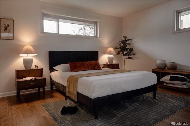 6530 W 26th Ave, Edgewater, CO 80214 - bedroom with wood finished floors and baseboards