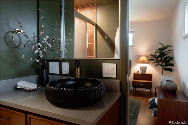 6530 W 26th Ave, Edgewater, CO 80214 - bathroom with wood finished floors and a sink
