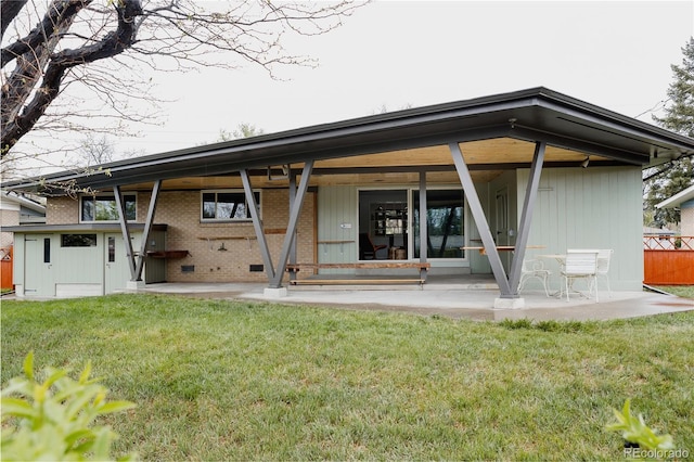 6530 W 26th Ave, Edgewater, CO 80214 - back of house with brick siding and a patio
