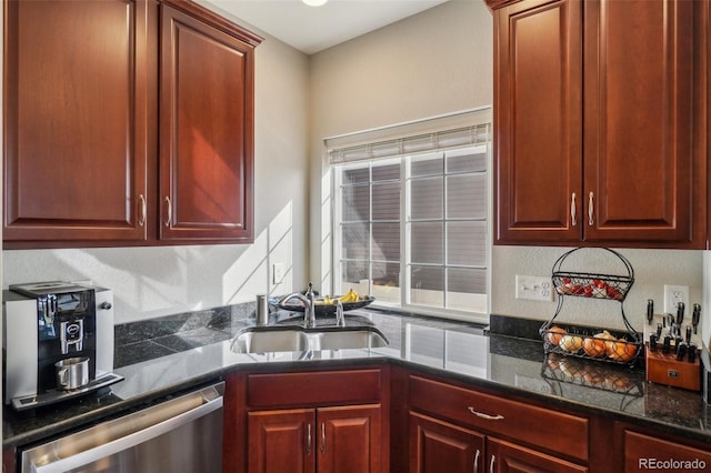 kitchen featuring dishwasher, dark stone countertops, a sink, and reddish brown cabinets