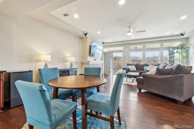 dining area featuring ceiling fan, dark wood-style flooring, visible vents, and recessed lighting