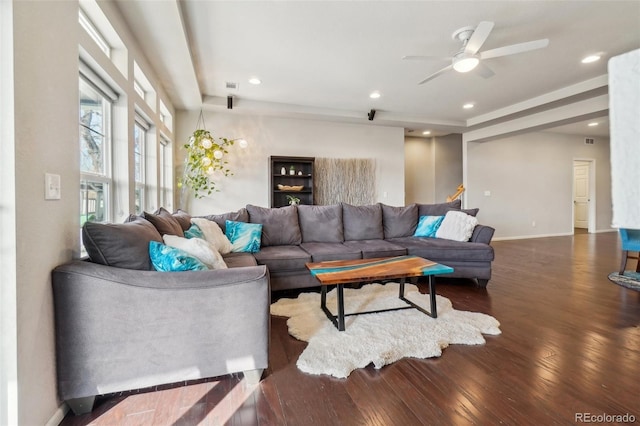 living area featuring visible vents, baseboards, hardwood / wood-style floors, and recessed lighting