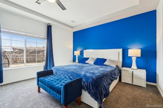 bedroom featuring carpet, visible vents, baseboards, and a ceiling fan