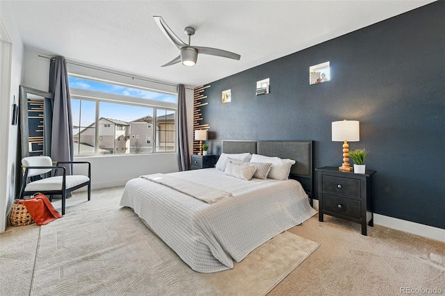 10123 Zeno St, Commerce City, CO 80022 - carpeted bedroom featuring baseboards, a ceiling fan, and an accent wall