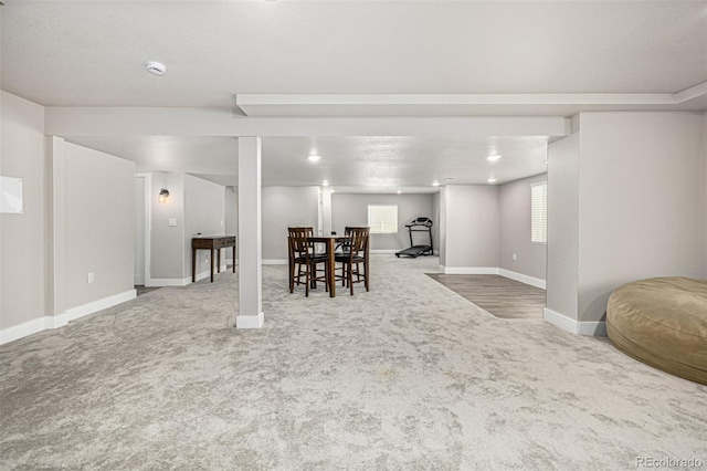 dining space with carpet floors and baseboards