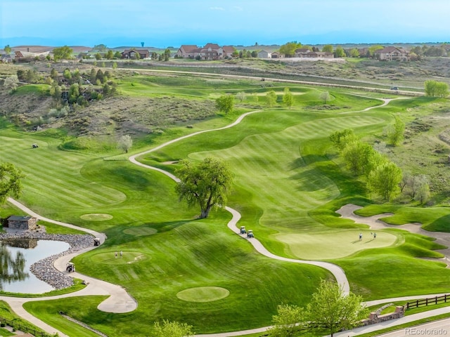 aerial view of residential area with a nearby body of water and a golf club