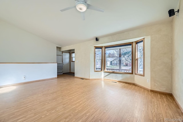 empty room featuring ceiling fan and light wood-type flooring