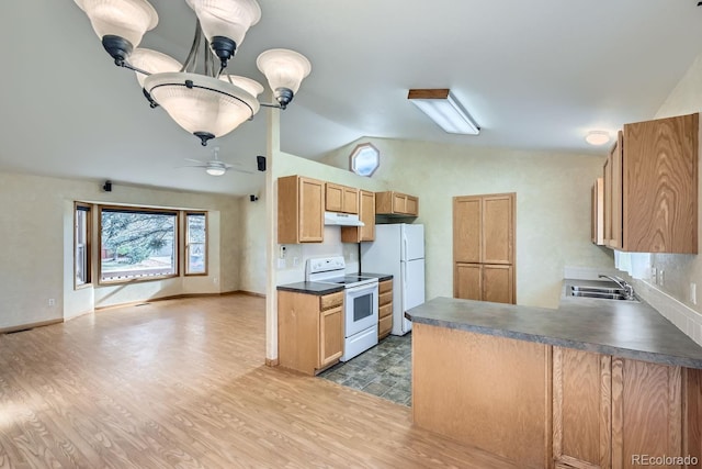 kitchen featuring white appliances, vaulted ceiling, ceiling fan, sink, and wood-type flooring