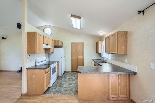 kitchen with lofted ceiling, dark hardwood / wood-style floors, white appliances, and kitchen peninsula