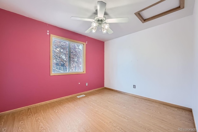 empty room with light wood-type flooring and ceiling fan