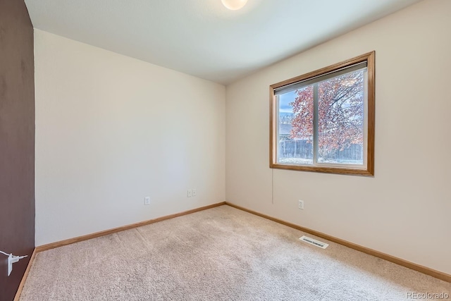 view of carpeted spare room