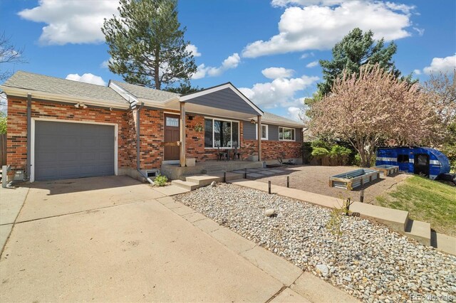 882 E Briarwood Cir, Centennial, CO 80122 - single story home with an attached garage, driveway, and brick siding