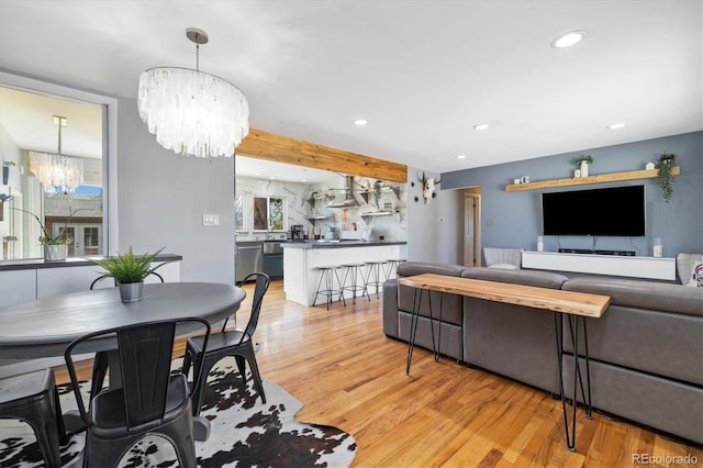 882 E Briarwood Cir, Centennial, CO 80122 - living area featuring an inviting chandelier, light wood-style floors, and recessed lighting